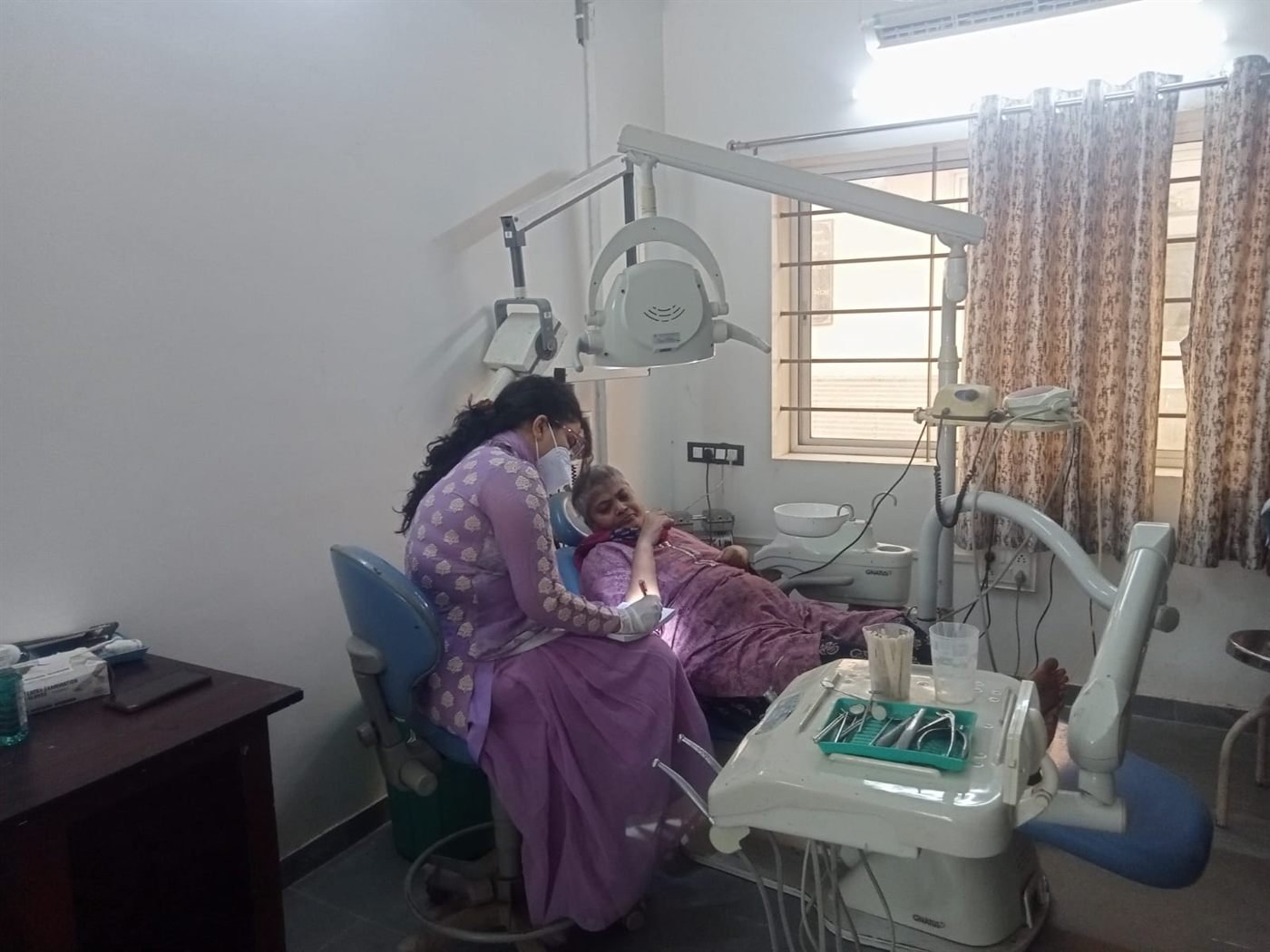 A patient receiving assisted treatment in the Seva Tirth ward