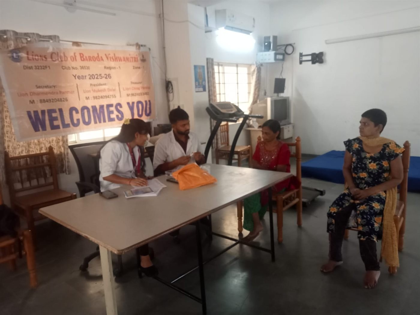 A rehabilitation session with a therapist guiding a patient